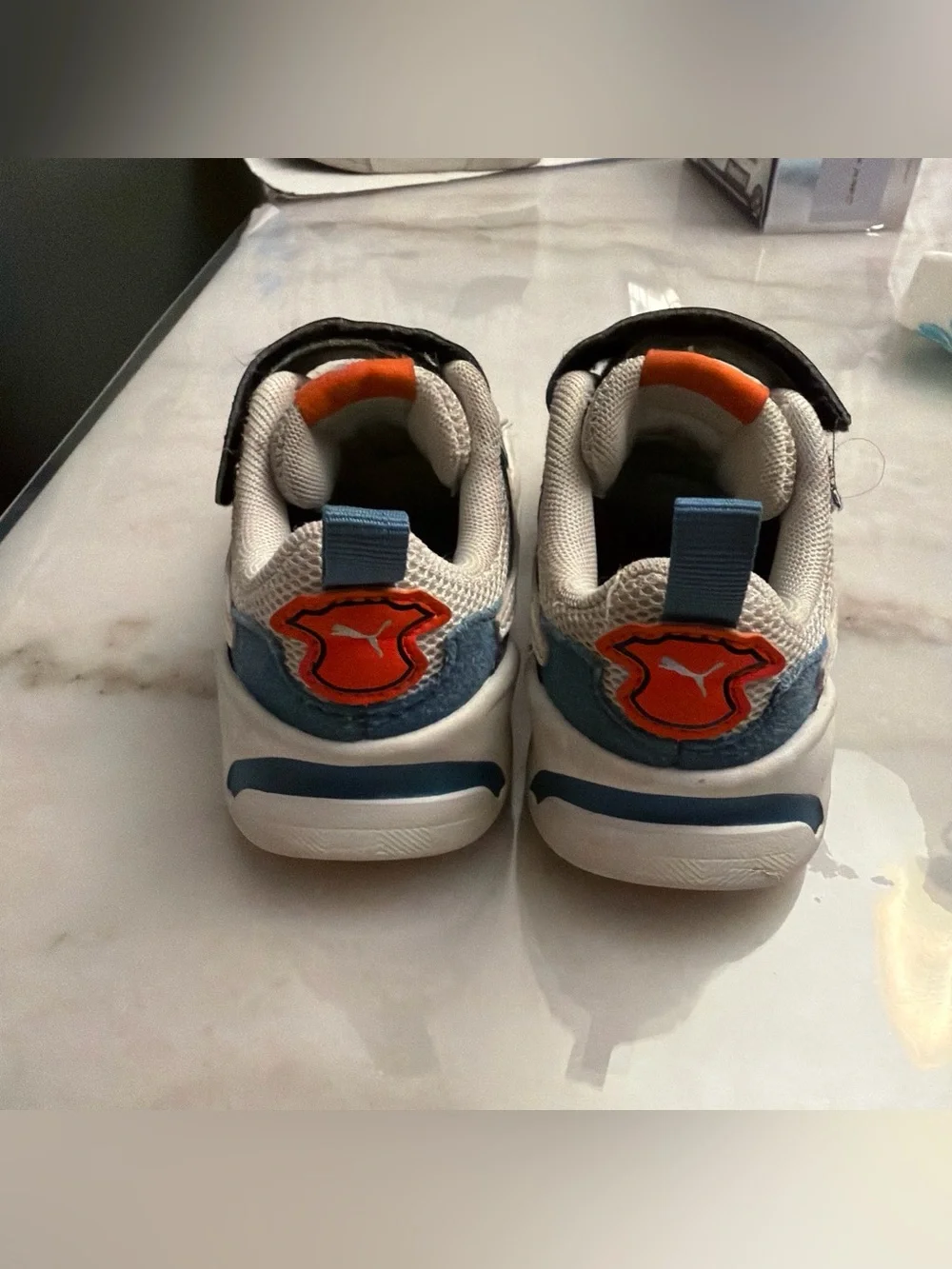 Puma Kids White and Navy Sneakers with Orange Logo Accent